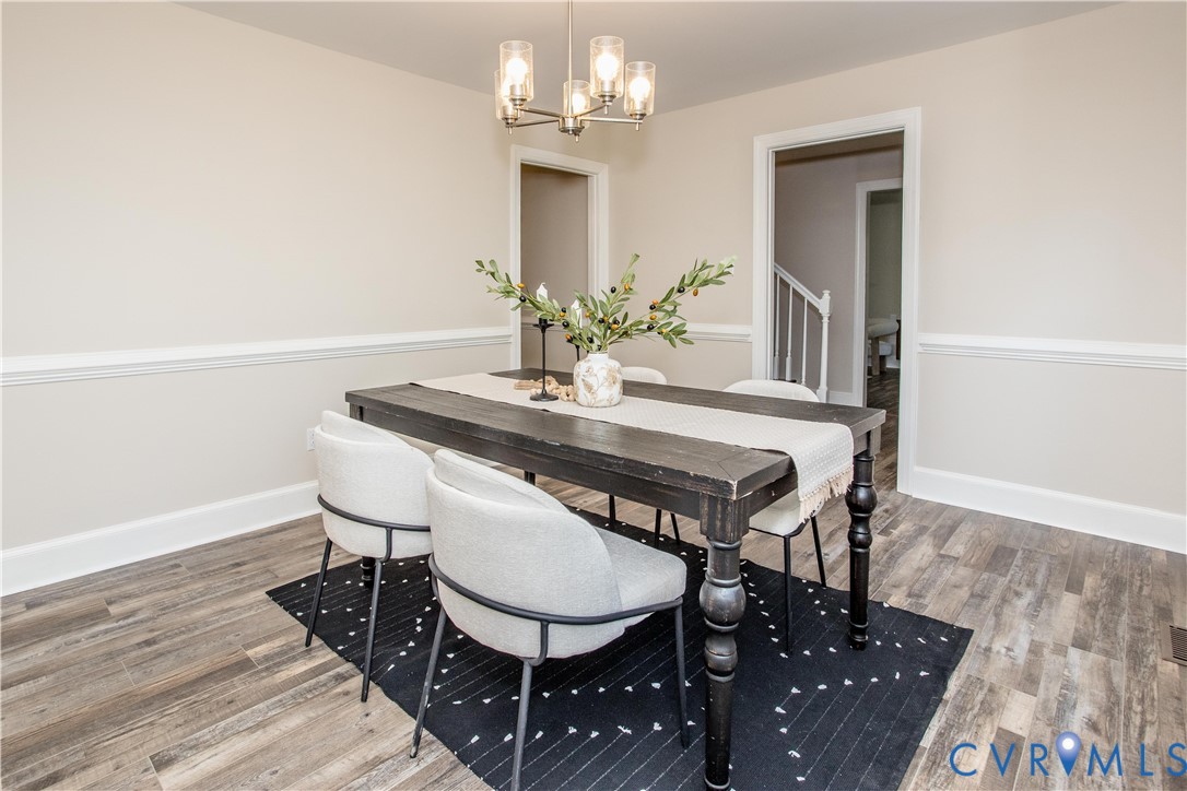 13110 Hensley Road Midlothian, VA 23112 - Photo 9 of 24 a view of a dining room with furniture and wooden floor