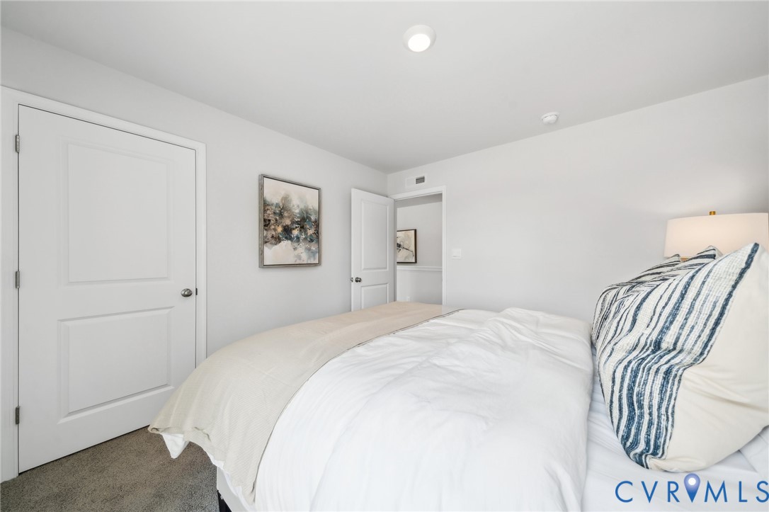 16907 Barmer Road Chesterfield, VA 23832 - Photo 22 of 31 a bedroom with a bed and a painting on the wall