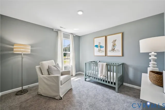 a living room with furniture and white walls