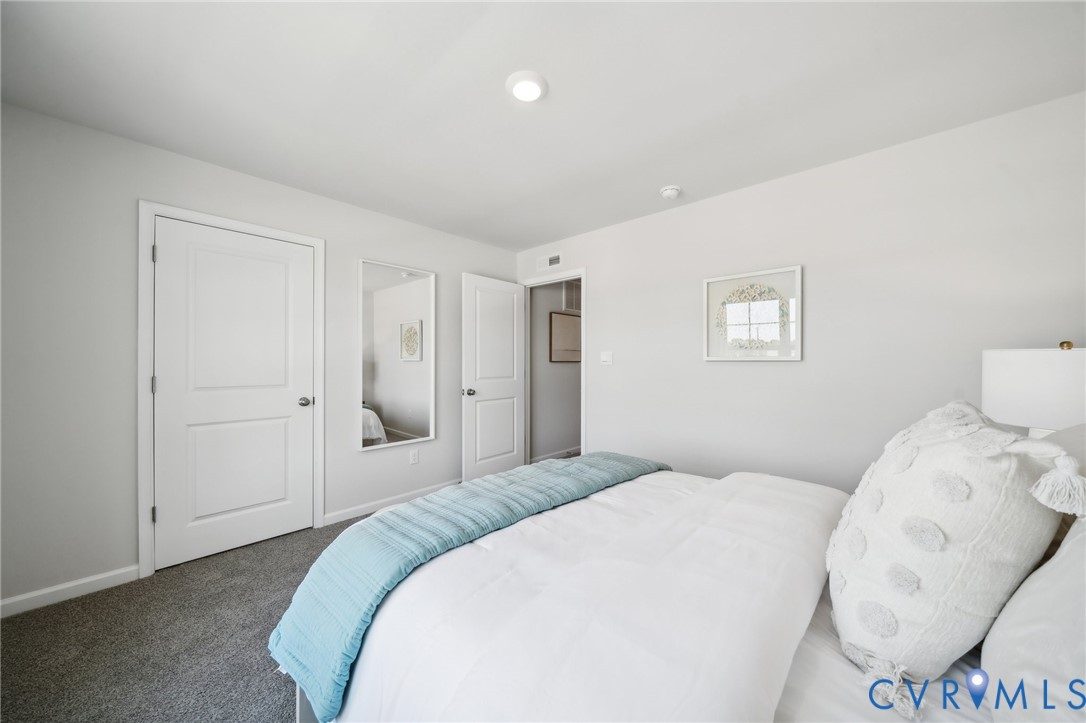 16907 Barmer Road Chesterfield, VA 23832 - Photo 28 of 31 a bedroom with a bed and a lamp