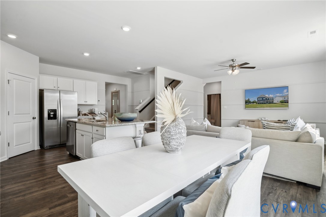 16907 Barmer Road Chesterfield, VA 23832 - Photo 8 of 31 a kitchen with a table chairs refrigerator and microwave