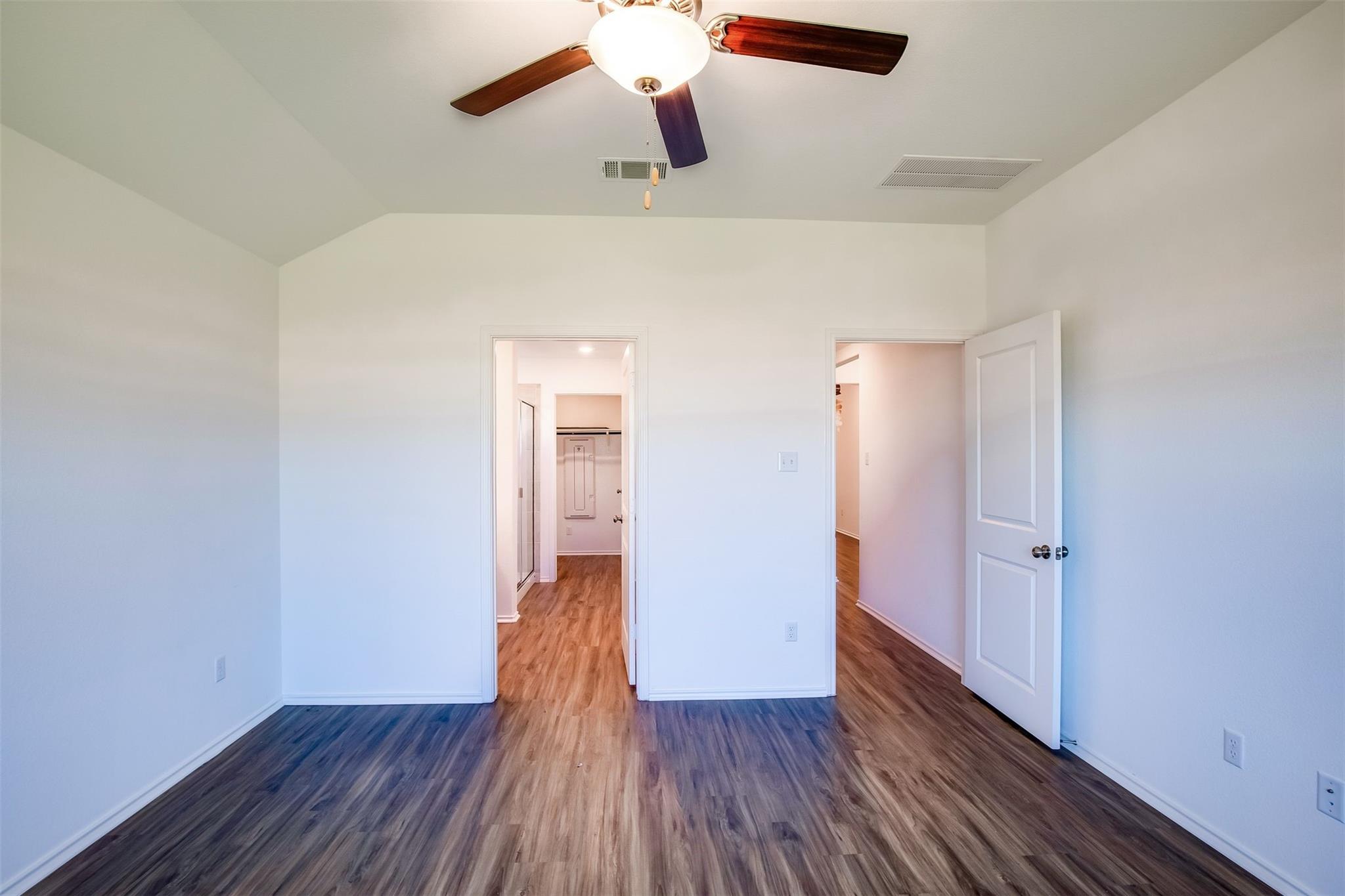 614 Milliner Loop Hutto, TX 78634 - Photo 15 of 25 A quiet retreat with stylish wood-look flooring and a modern ceiling fan for ultimate comfort.