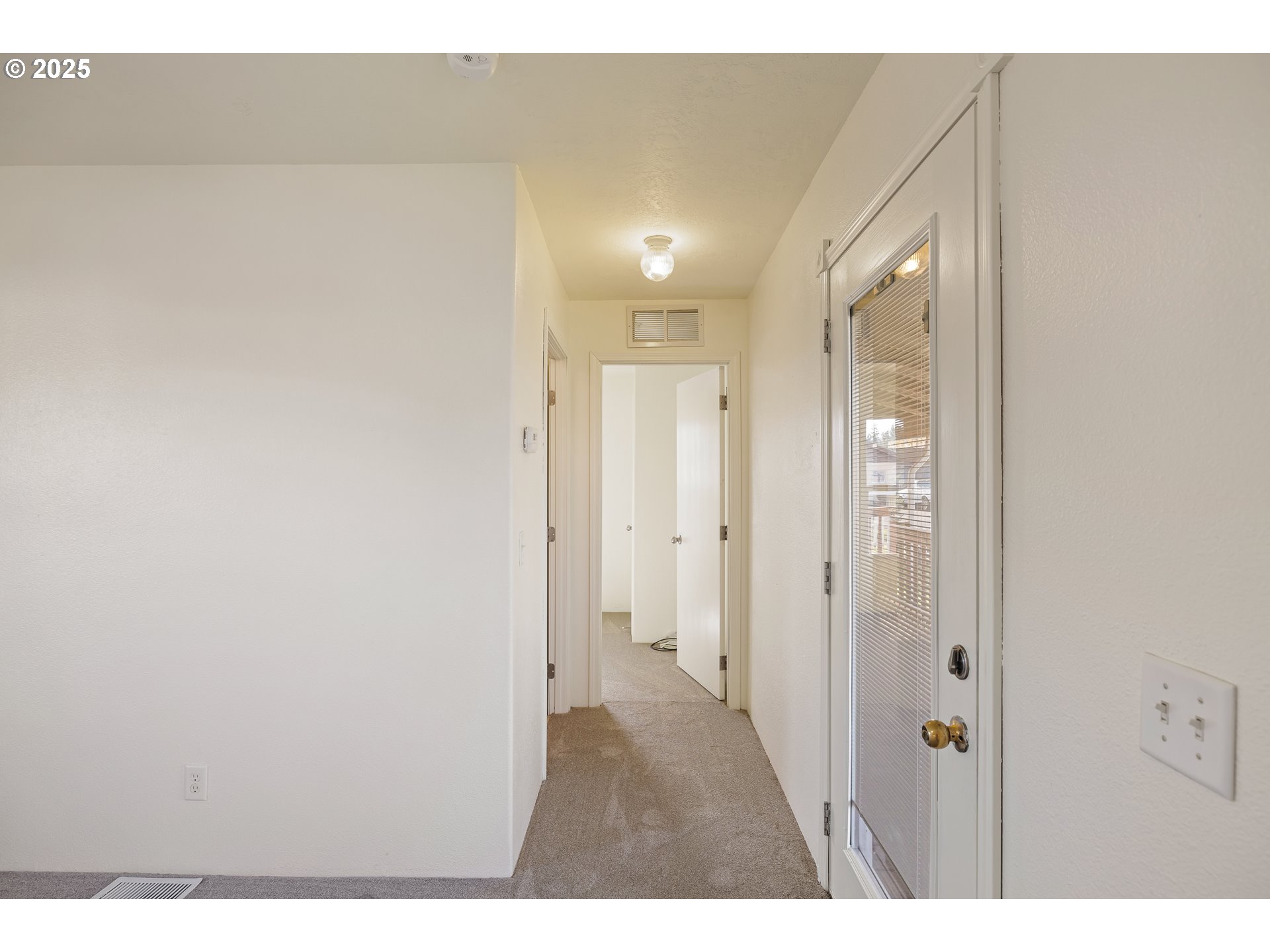 82849 Minnick Road Dexter, OR 97431 - Photo 18 of 41 a view of a hallway with wooden floor