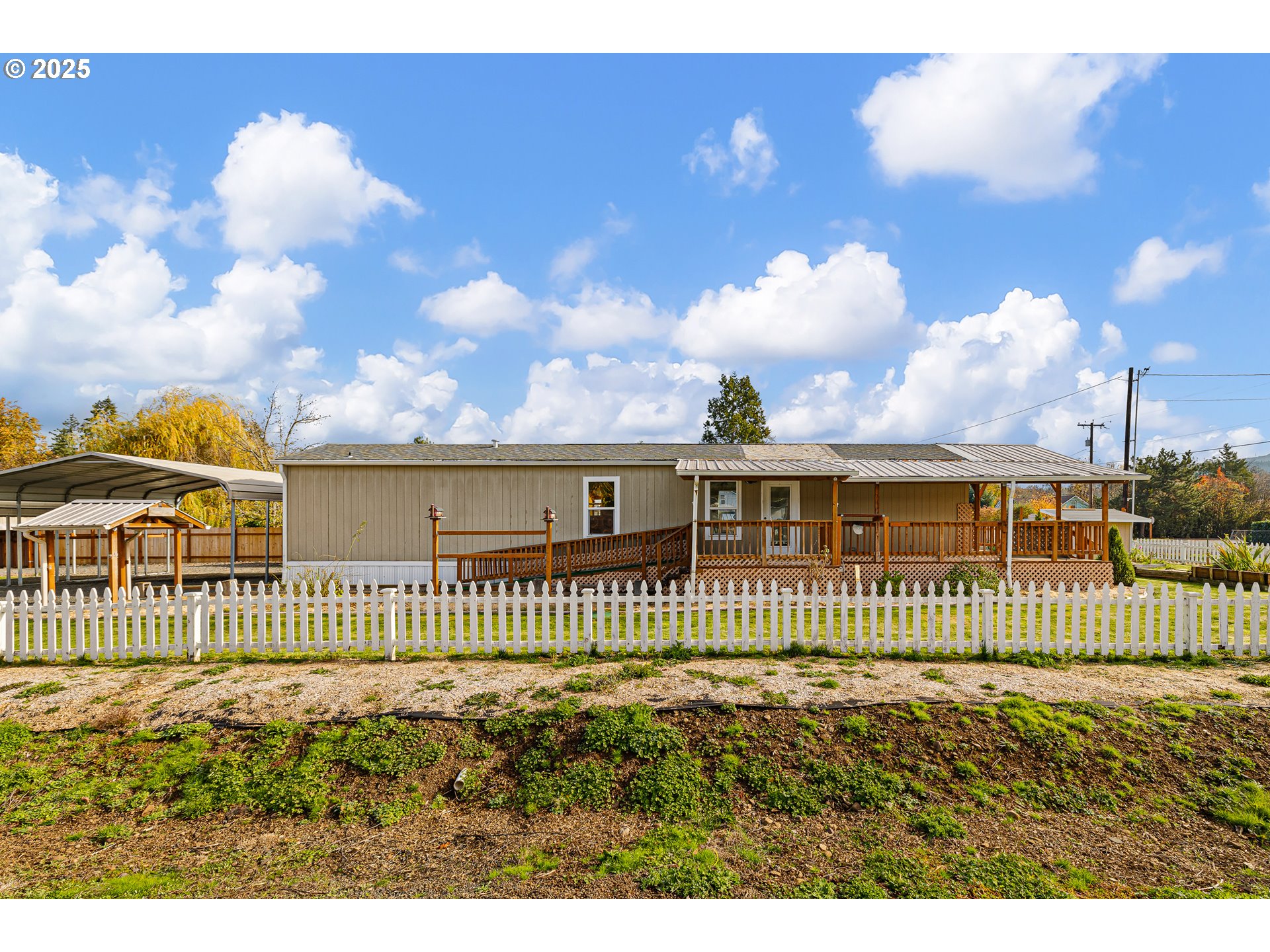 82849 Minnick Road Dexter, OR 97431 - Photo 2 of 41 a view of a house with a fence