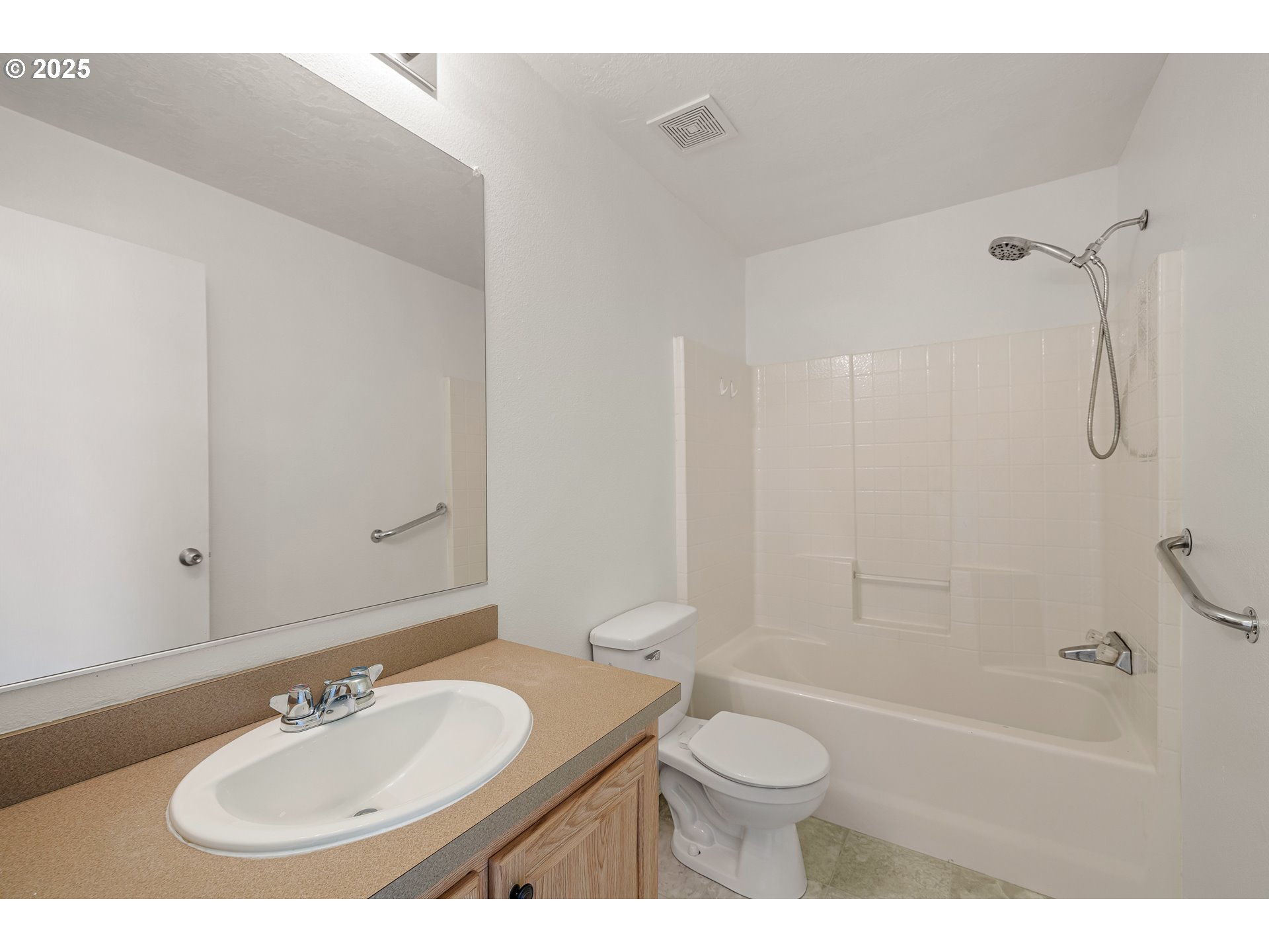 82849 Minnick Road Dexter, OR 97431 - Photo 22 of 41 a bathroom with a granite countertop sink toilet a mirror and shower