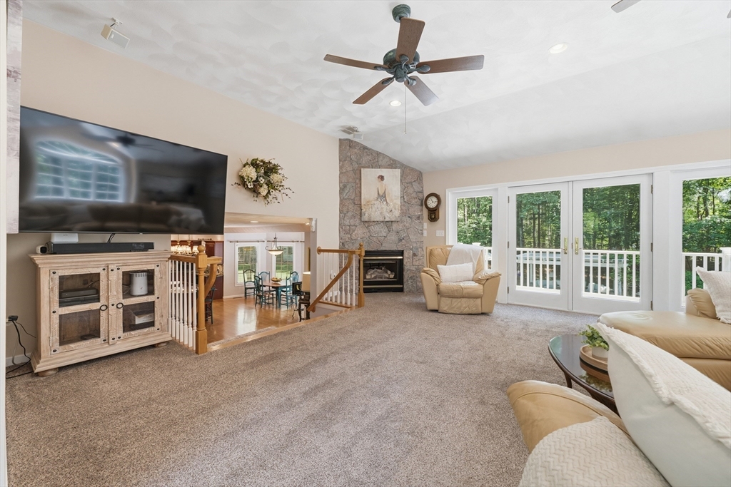 25 Haymeadow Road Boxford, MA 01921 - Photo 20 of 42 a living room with furniture and a flat screen tv