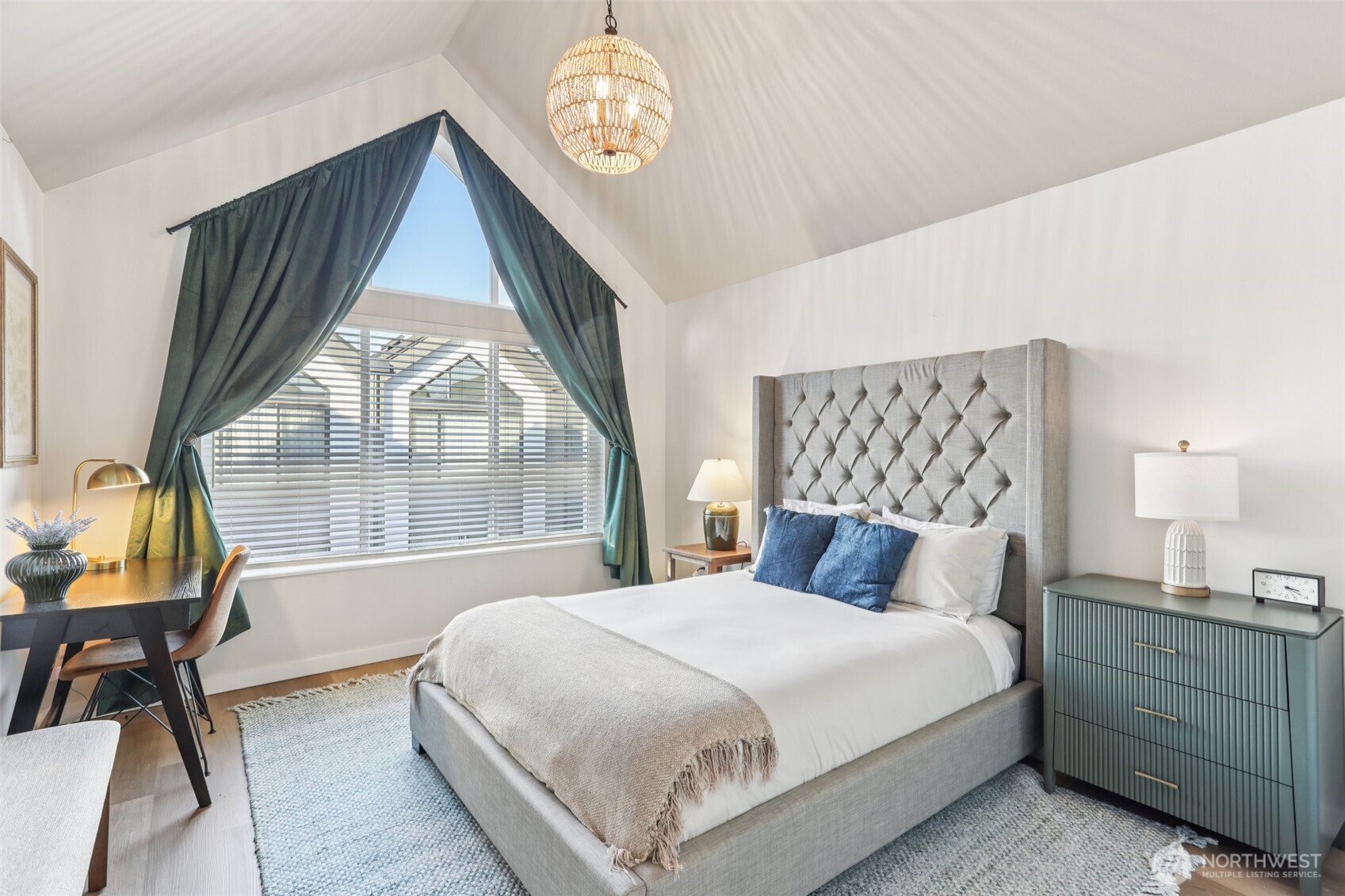 7514 43rd Avenue South, Unit B Seattle, WA 98118 - Photo 13 of 40 a bedroom with a large bed and a window