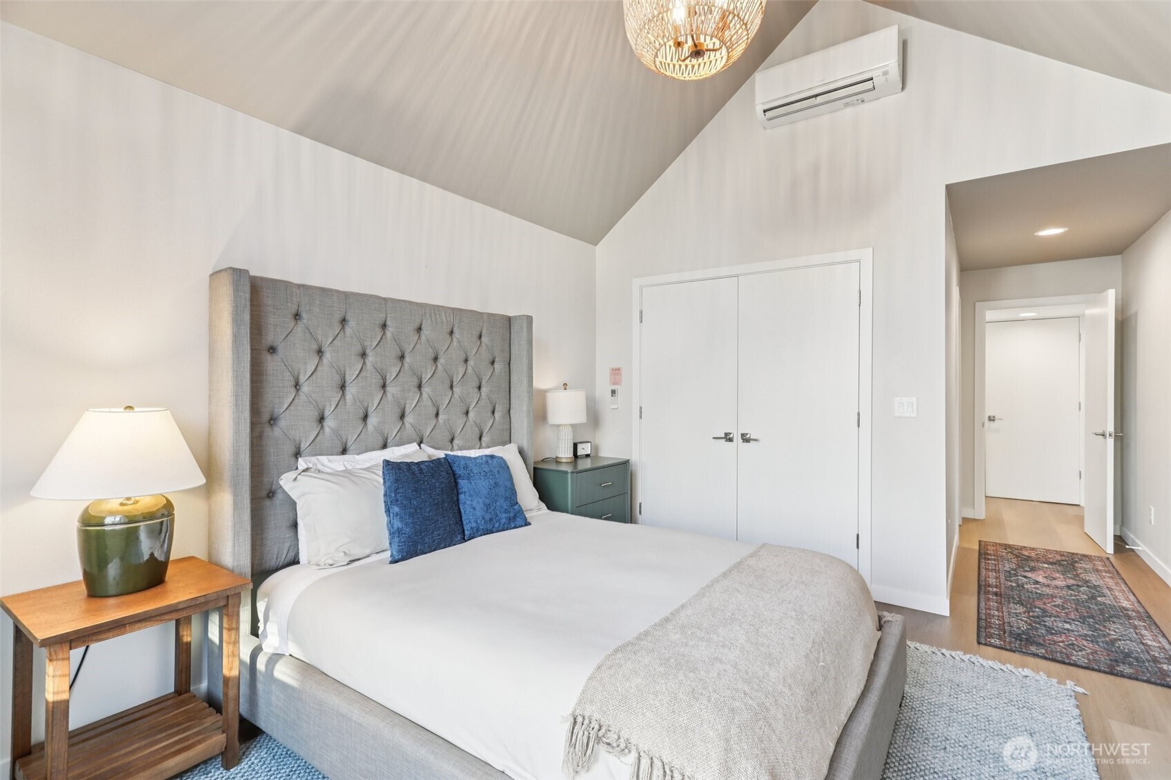 7514 43rd Avenue South, Unit B Seattle, WA 98118 - Photo 14 of 40 a bedroom with a bed and a painting on the wall