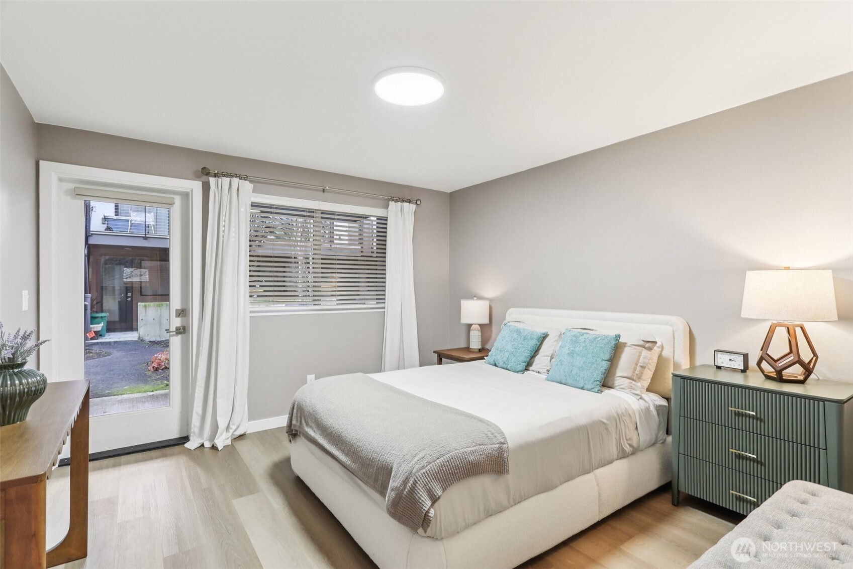 7514 43rd Avenue South, Unit B Seattle, WA 98118 - Photo 20 of 40 a bedroom with a bed and a window