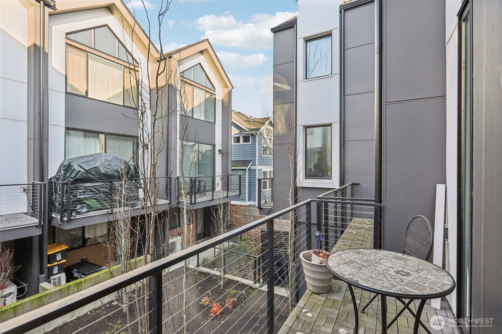 7514 43rd Avenue South, Unit B Seattle, WA 98118 - Photo 24 of 40 a view of a balcony with chairs