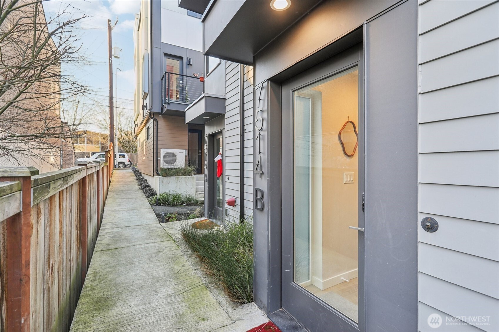 7514 43rd Avenue South, Unit B Seattle, WA 98118 - Photo 30 of 40 a view of a brick house with front door
