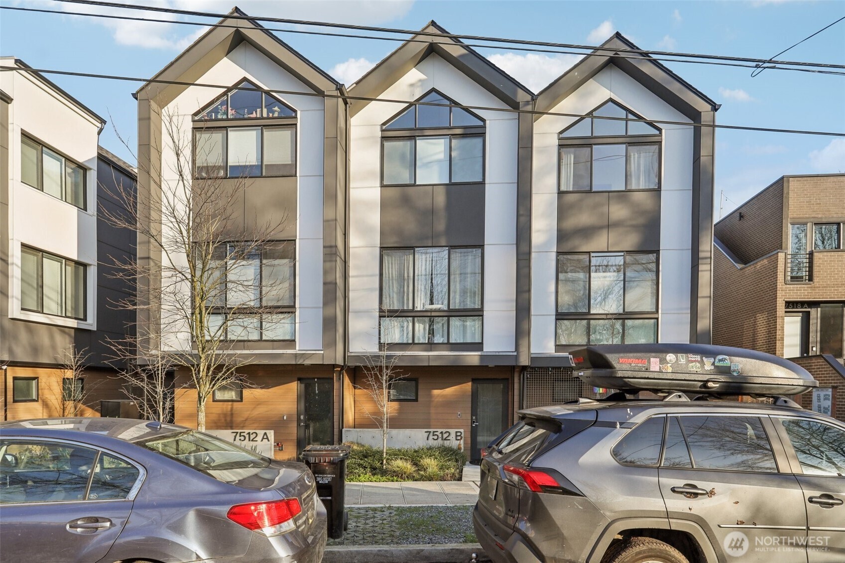 7514 43rd Avenue South, Unit B Seattle, WA 98118 - Photo 3 of 40 a front view of a house with cars parked