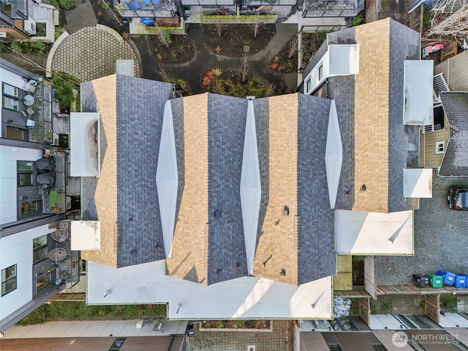 7514 43rd Avenue South, Unit B Seattle, WA 98118 - Photo 37 of 40 a aerial view of a house with a yard and large tree