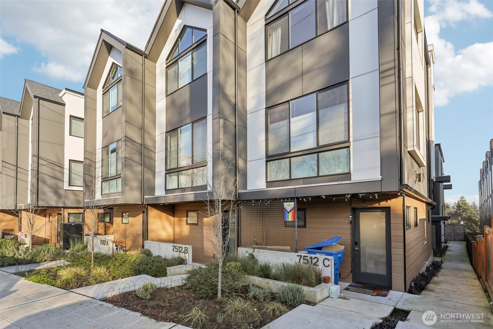 7514 43rd Avenue South, Unit B Seattle, WA 98118 - Photo 4 of 40 a view of a building with a street
