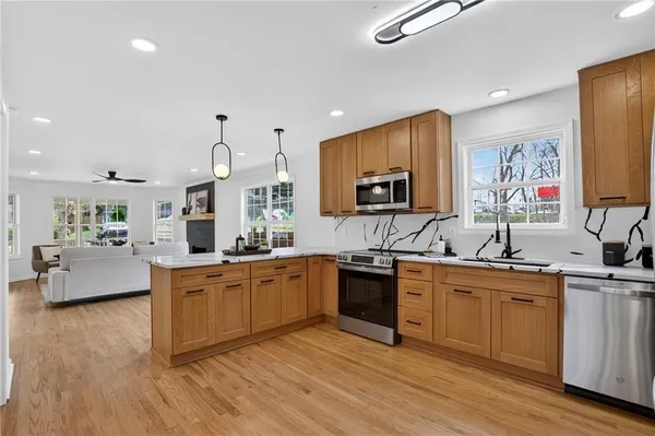 a kitchen with refrigerator and microwave