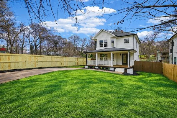 a view of a house with a yard