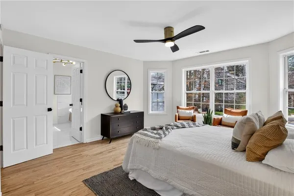 a bed room with a bed and a mirror