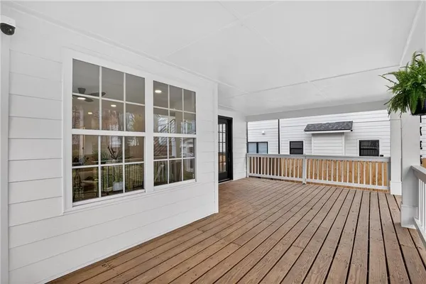 a view of an entryway with wooden floor