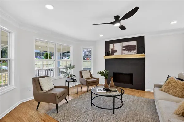 a living room with furniture and a fireplace