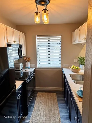 a kitchen with a large stove a sink dishwasher and a stove