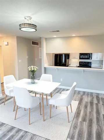 a view of a dining room with furniture