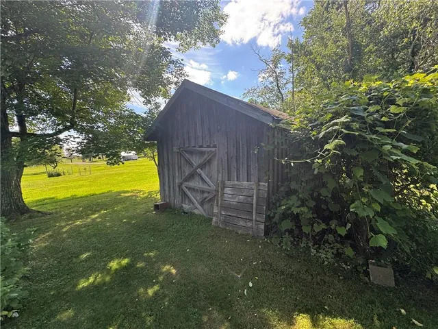 a view of a house with a backyard