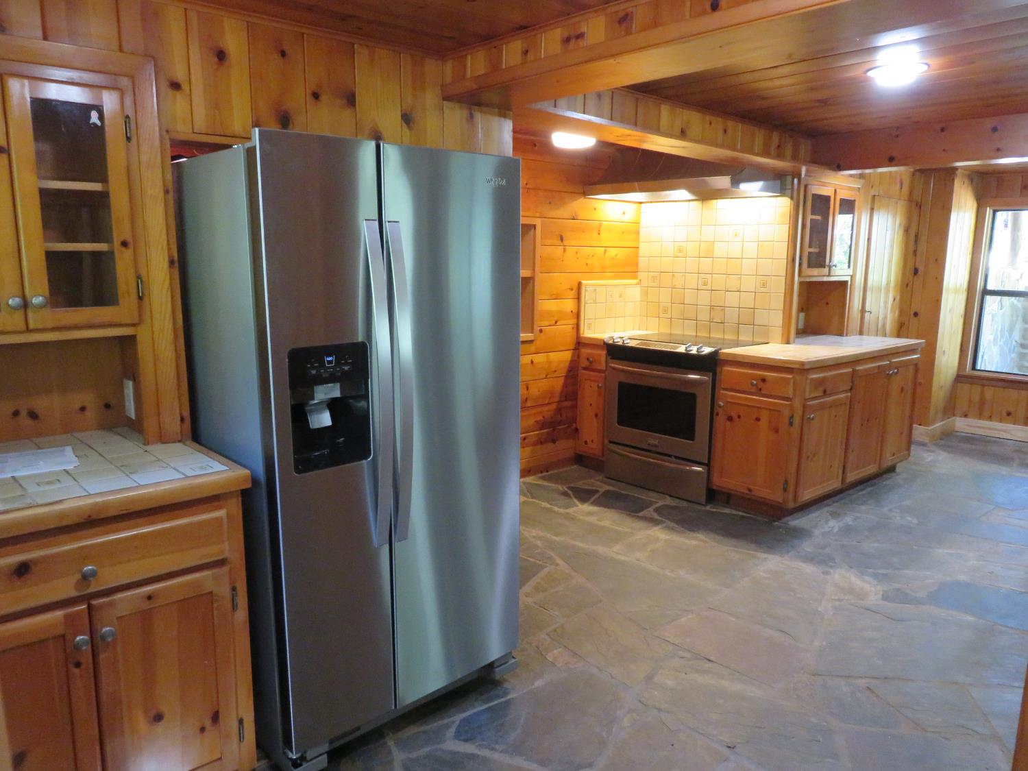 2563 Woodhouse Mine Road West Point, CA 95255 - Photo 33 of 49 a kitchen with stainless steel appliances granite countertop a refrigerator and a stove