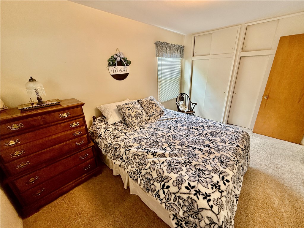 114 Columbus Drive Decatur, IL 62526 - Photo 14 of 29 a bedroom with a bed and a dresser