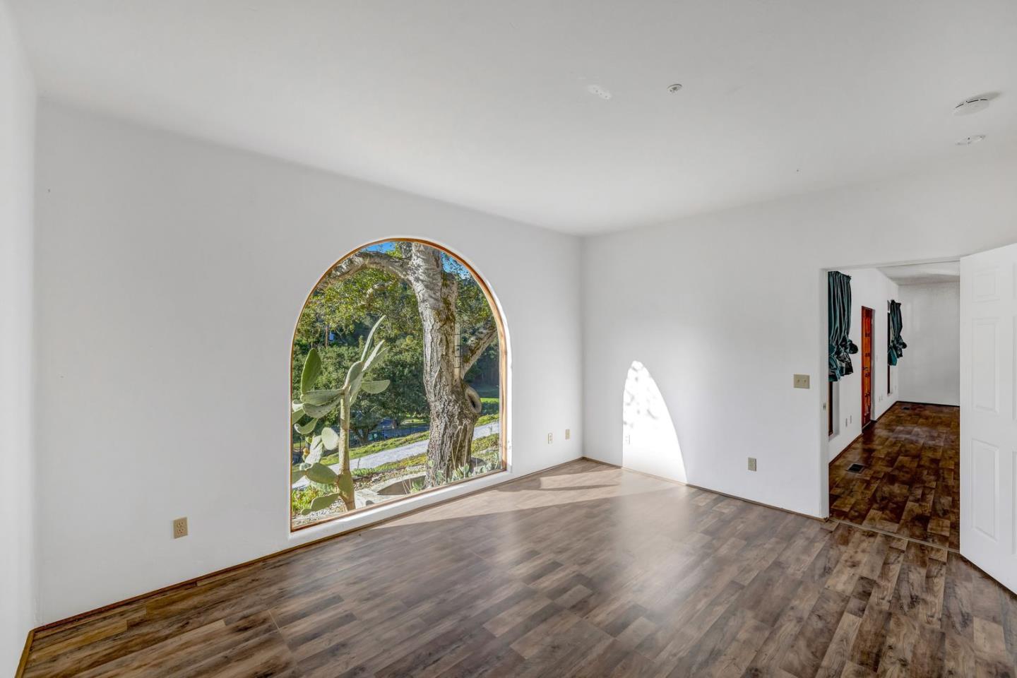 90 Harper Canyon Road Salinas, CA 93908 - Photo 14 of 47 a view of empty room with floor to ceiling window