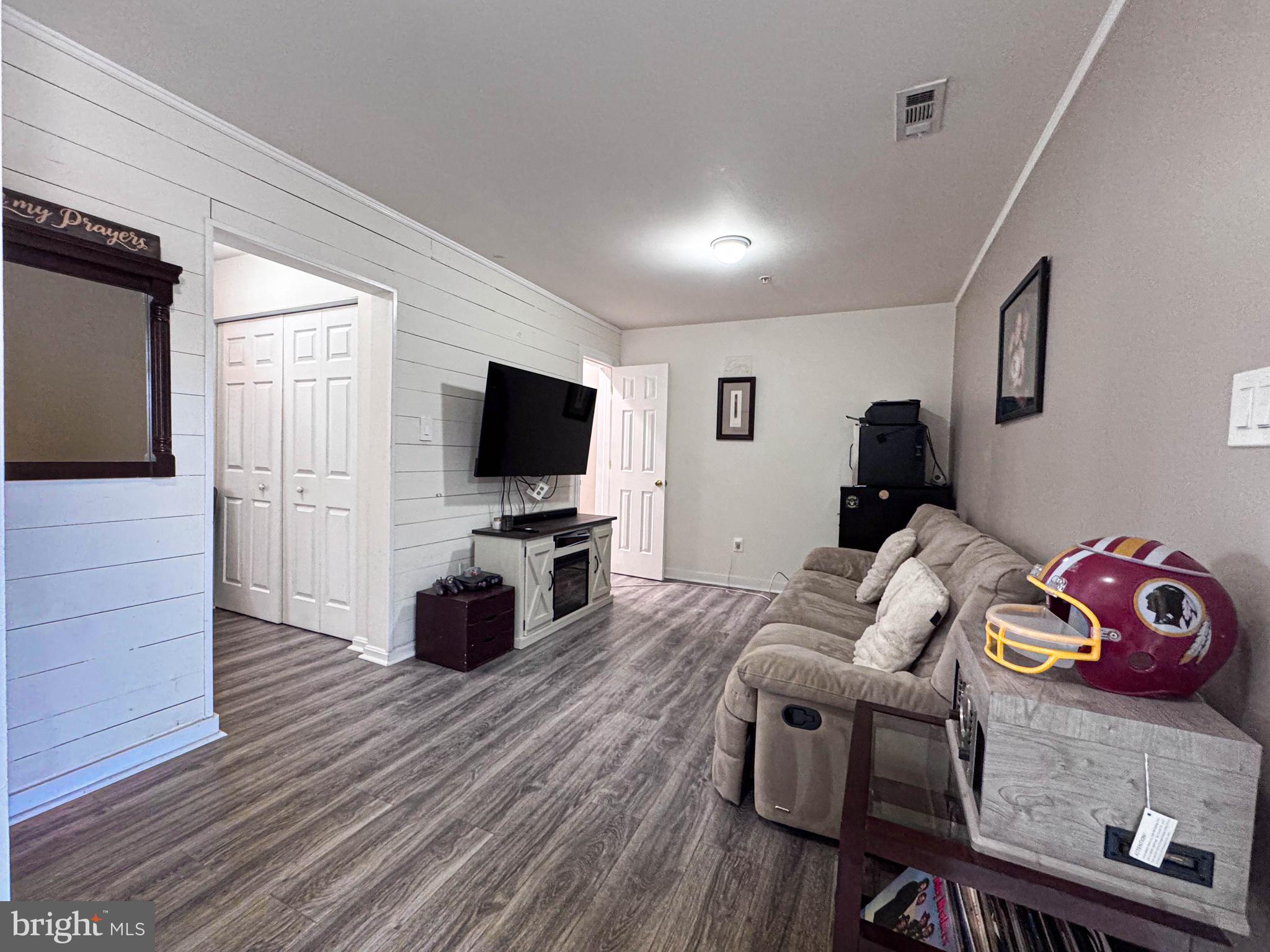 68 Millhaven Court Edgewater, MD 21037 - Photo 13 of 31 a living room with furniture and a flat screen tv