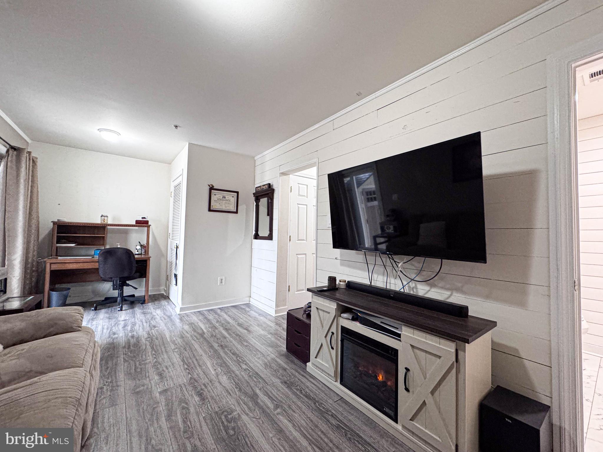 68 Millhaven Court Edgewater, MD 21037 - Photo 15 of 31 a living room with furniture and a flat screen tv