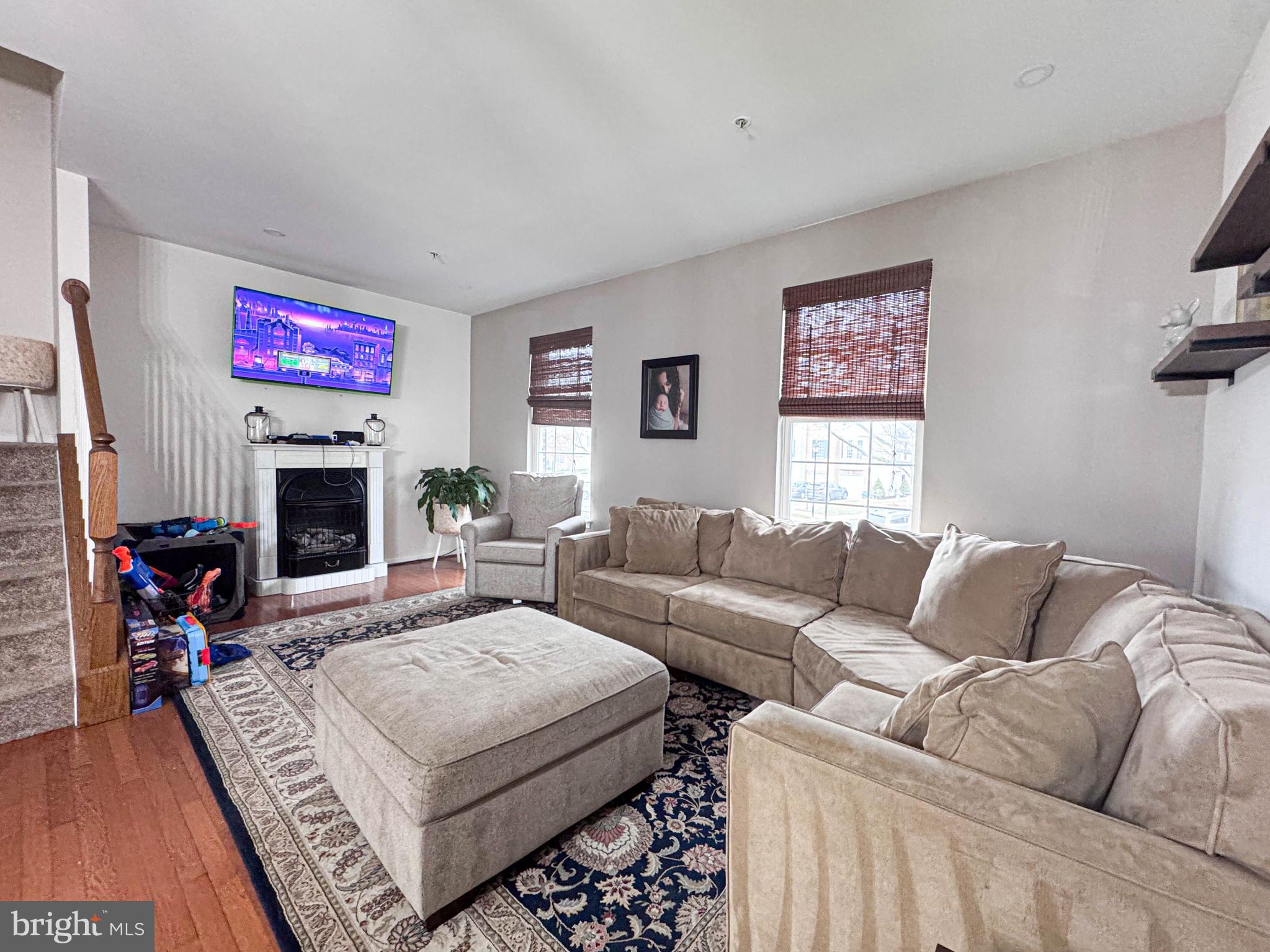 68 Millhaven Court Edgewater, MD 21037 - Photo 22 of 31 a living room with furniture a flat screen tv and a fireplace