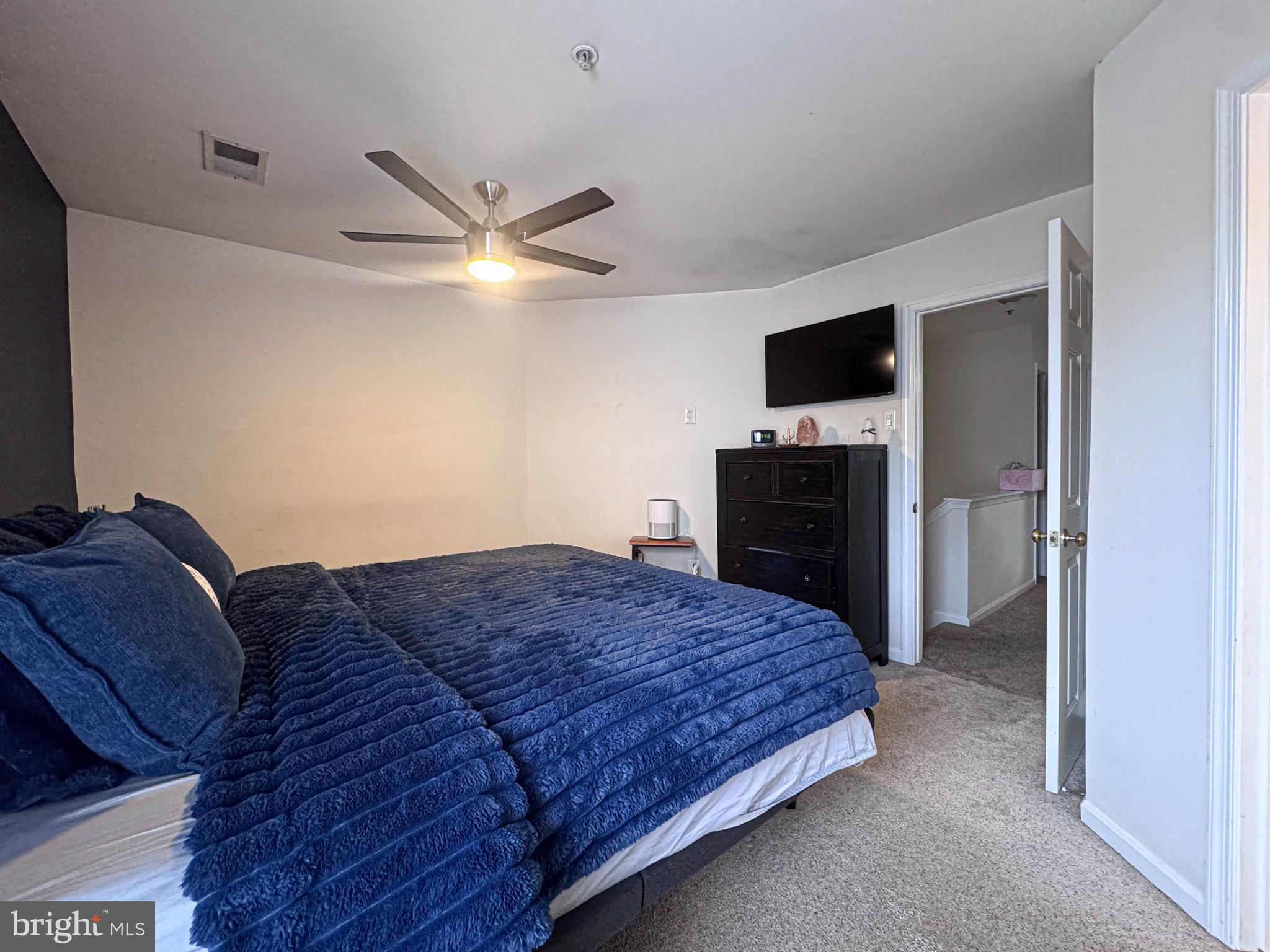 68 Millhaven Court Edgewater, MD 21037 - Photo 27 of 31 a spacious bedroom with a bed and a television