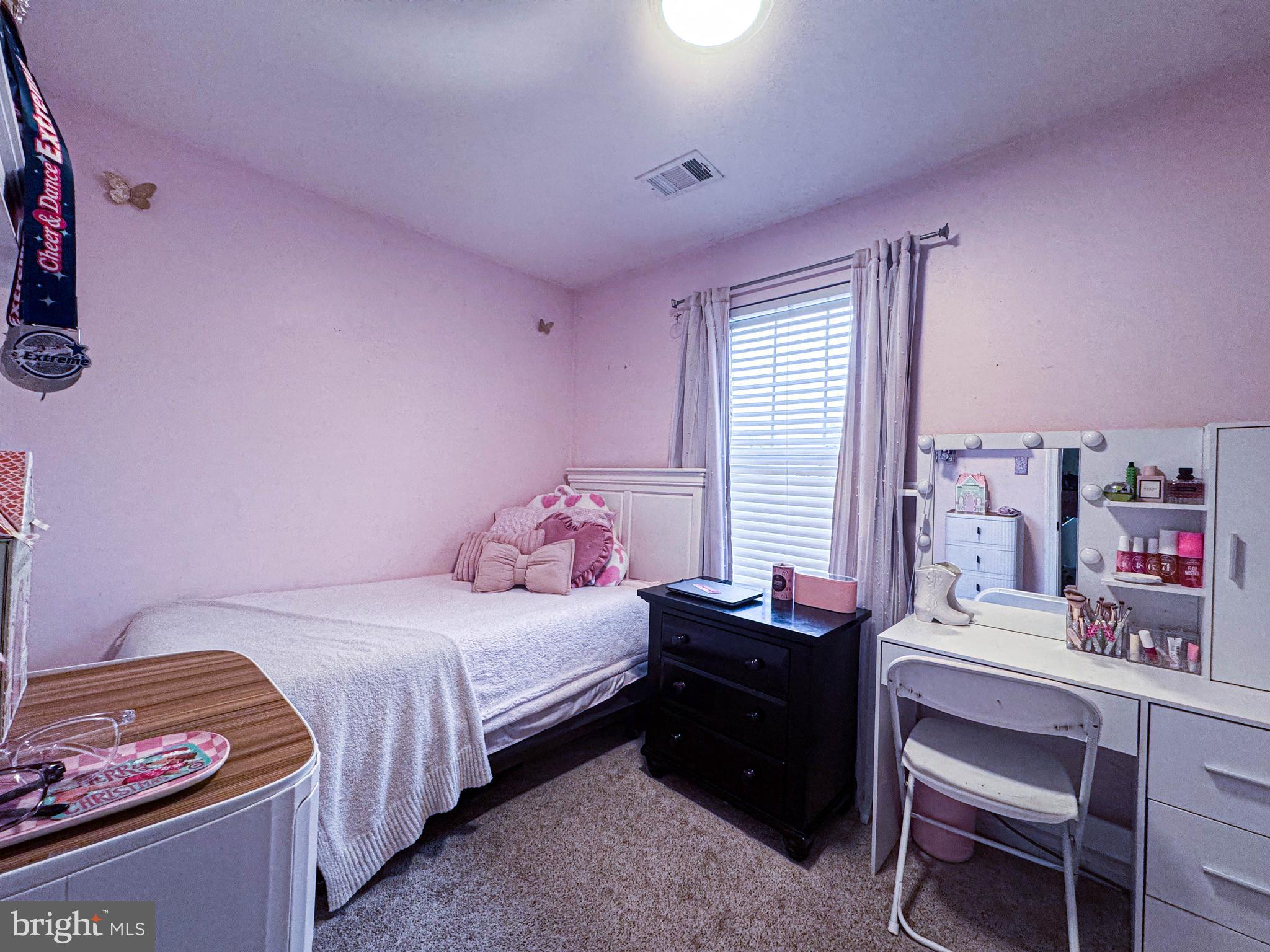 68 Millhaven Court Edgewater, MD 21037 - Photo 29 of 31 a bedroom with a bed and a window