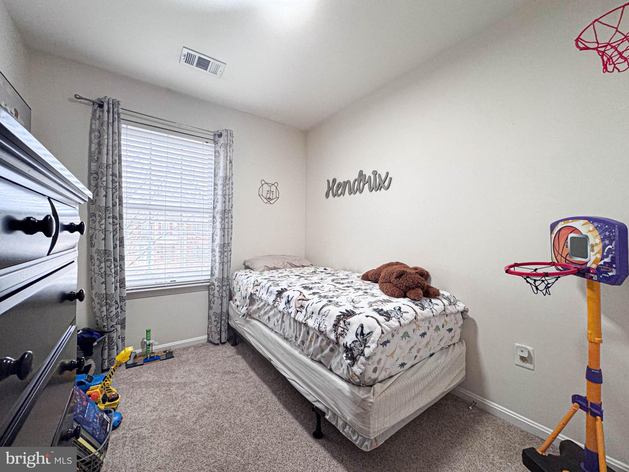 68 Millhaven Court Edgewater, MD 21037 - Photo 30 of 31 a bedroom with a bed and a window