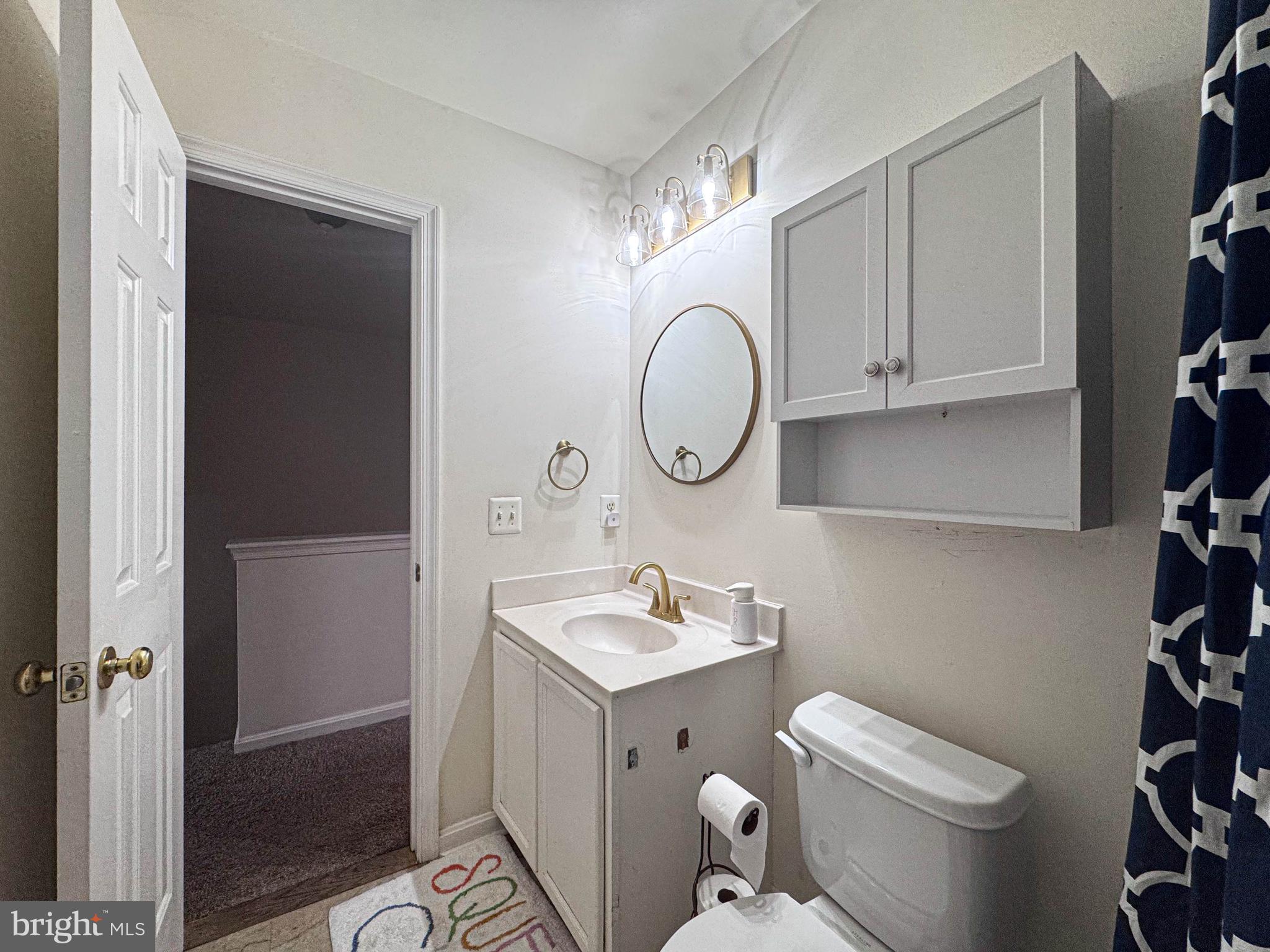68 Millhaven Court Edgewater, MD 21037 - Photo 31 of 31 a bathroom with a sink toilet and vanity