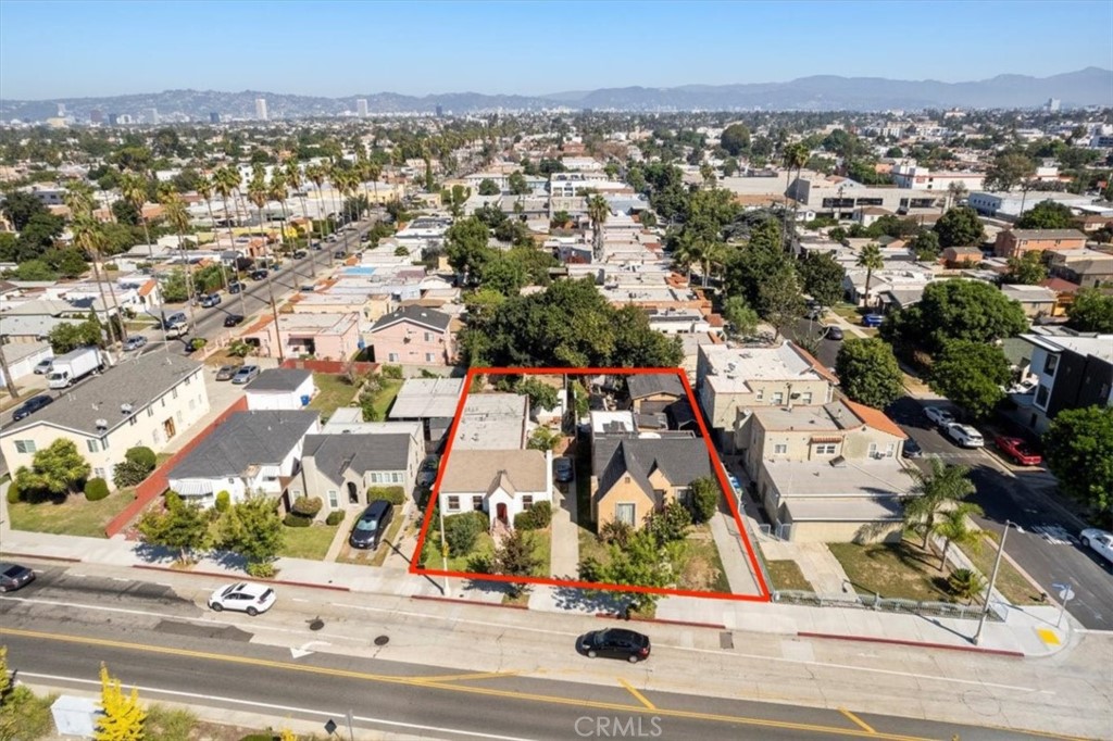 4011 West Exposition Boulevard Los Angeles, CA 90016 - Photo 1 of 14 an aerial view of residential houses with city view