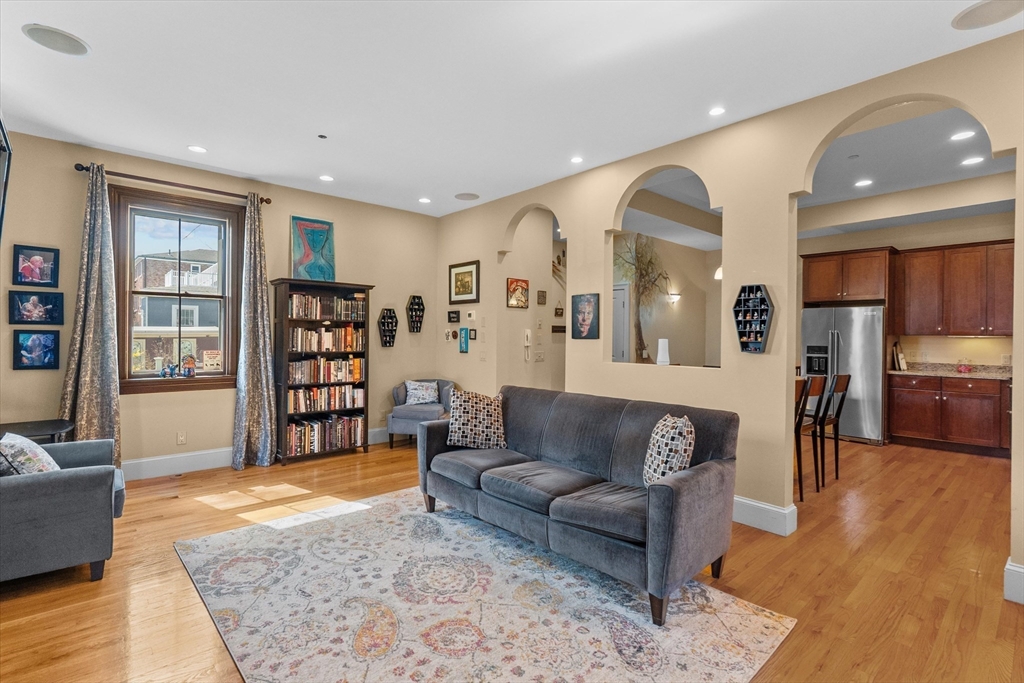 7 Winter Street, Unit 2 Salem, MA 01970 - Photo 11 of 42 a living room with furniture and a wooden floor