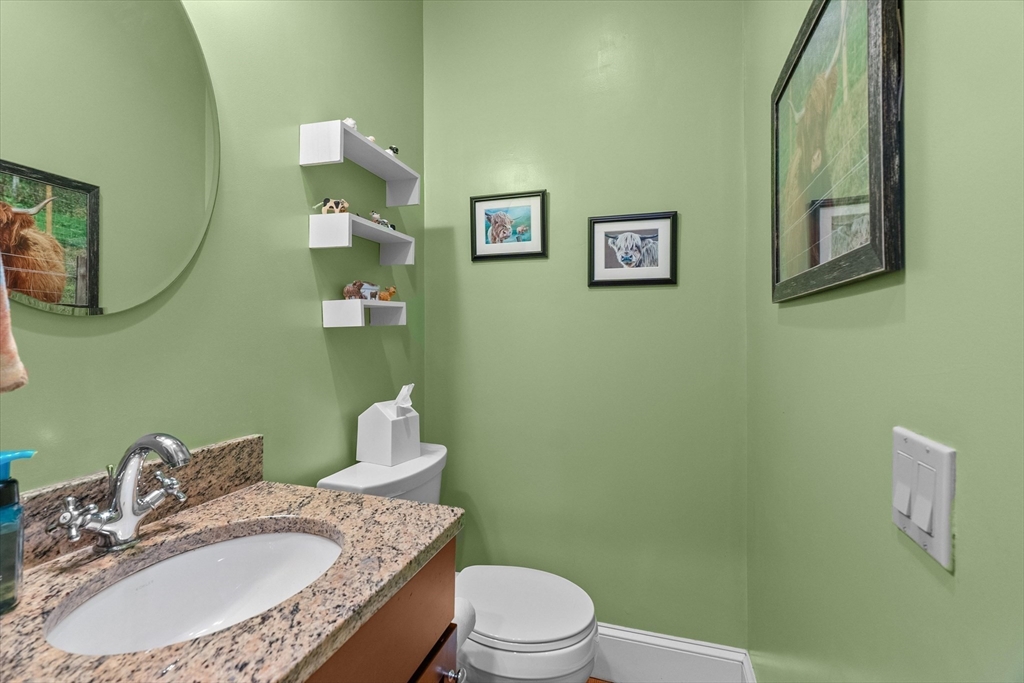 7 Winter Street, Unit 2 Salem, MA 01970 - Photo 14 of 42 a bathroom with a granite countertop sink mirror vanity and toilet