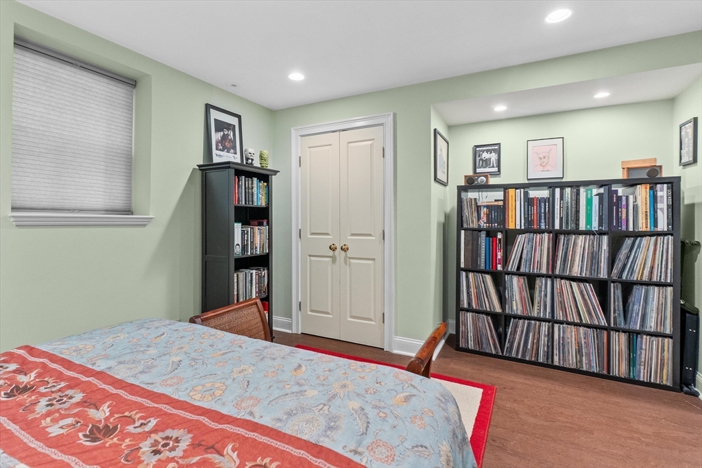 7 Winter Street, Unit 2 Salem, MA 01970 - Photo 18 of 42 a bedroom with furniture and a book shelf