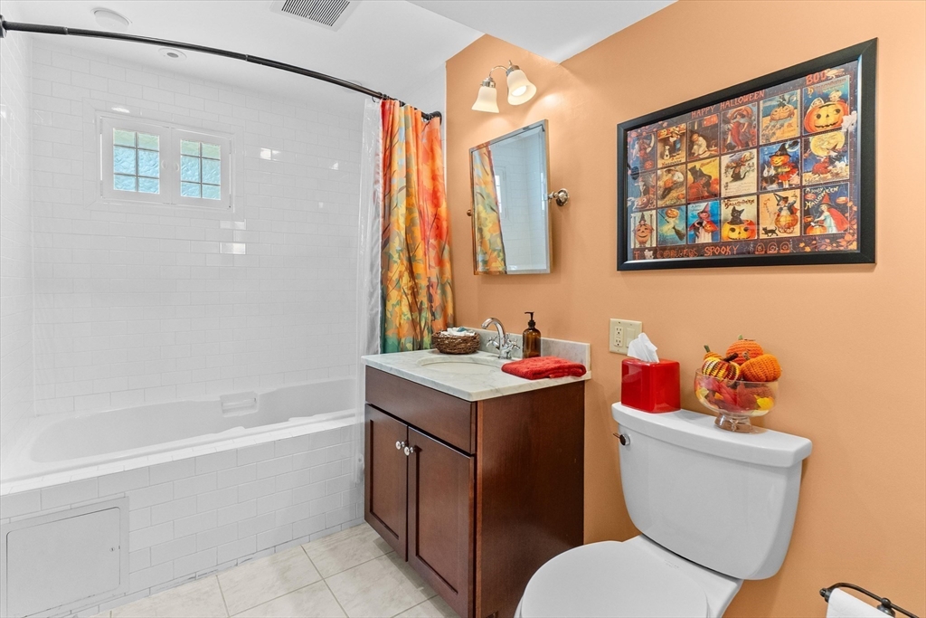 7 Winter Street, Unit 2 Salem, MA 01970 - Photo 19 of 42 a bathroom with a toilet a sink and a bathtub