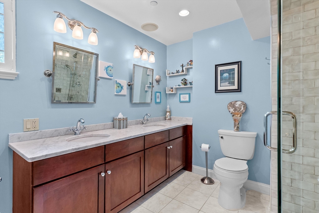 7 Winter Street, Unit 2 Salem, MA 01970 - Photo 23 of 42 a bathroom with a toilet sink and mirror