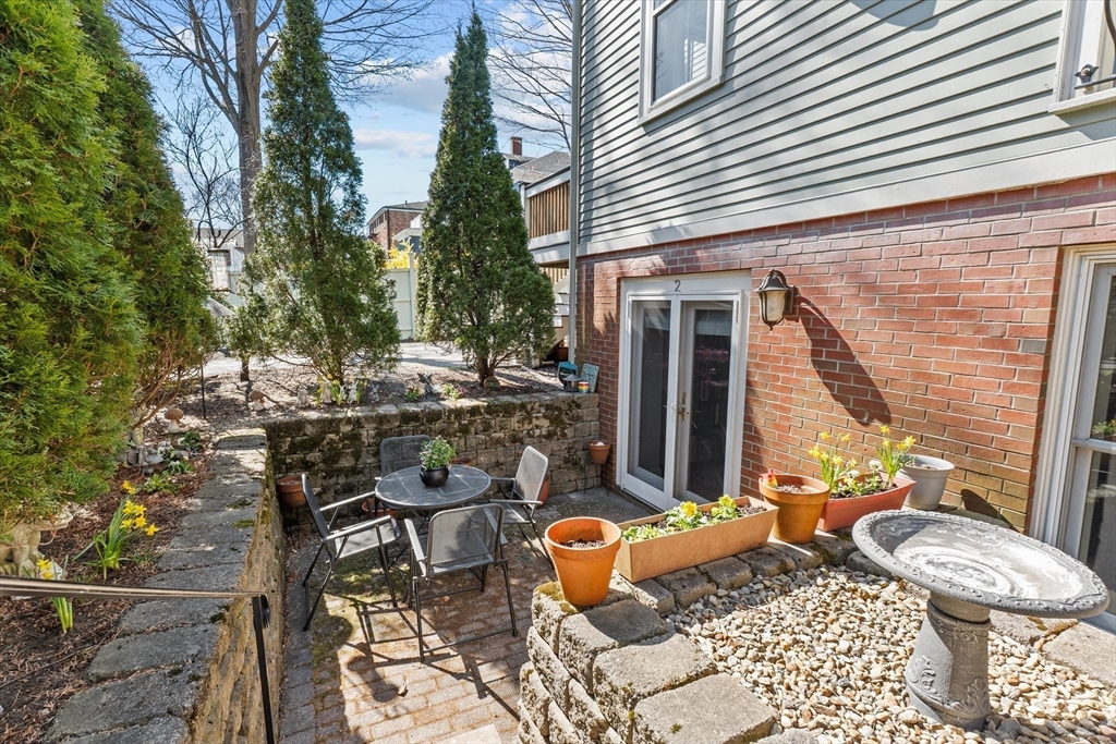 7 Winter Street, Unit 2 Salem, MA 01970 - Photo 28 of 42 a view of a patio with couple of chairs and a potted plant