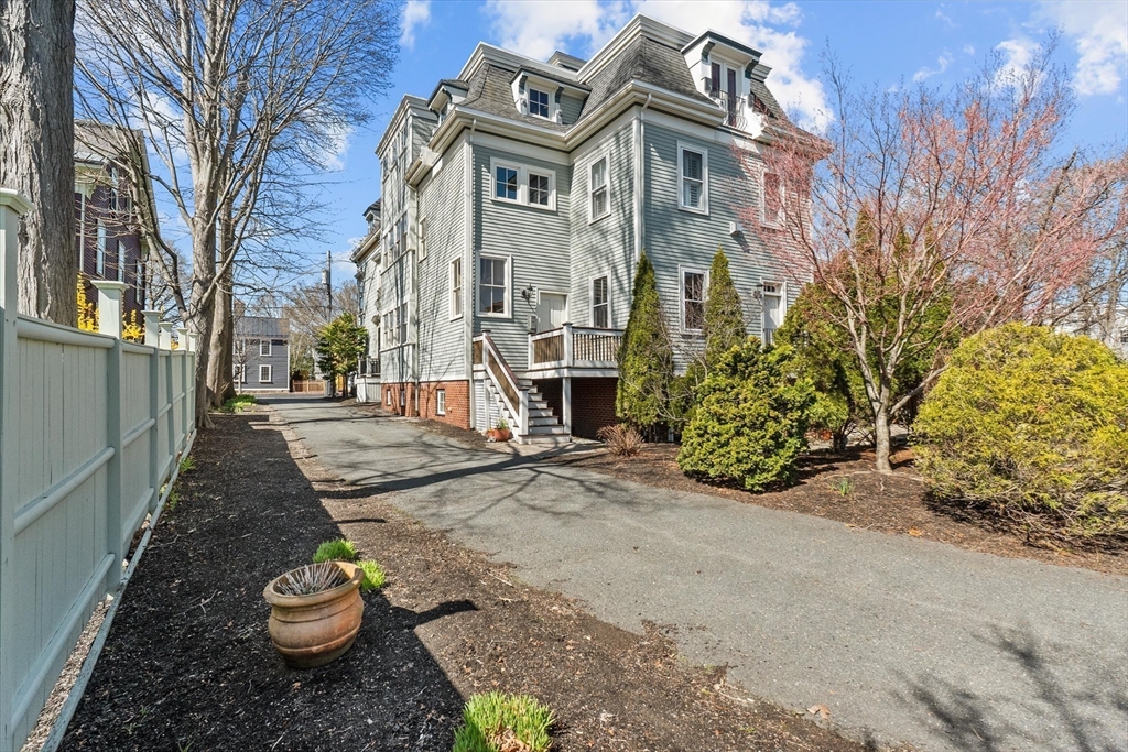7 Winter Street, Unit 2 Salem, MA 01970 - Photo 32 of 42 a view of a street with a building in the background