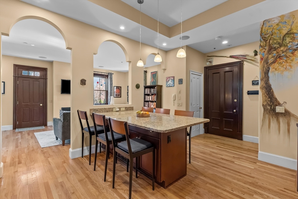 7 Winter Street, Unit 2 Salem, MA 01970 - Photo 6 of 42 a view of a dining room with furniture and wooden floor