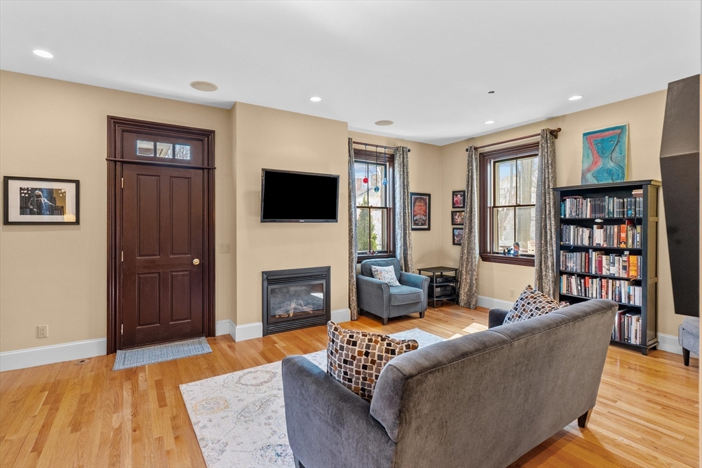 7 Winter Street, Unit 2 Salem, MA 01970 - Photo 10 of 42 a living room with furniture and a fireplace