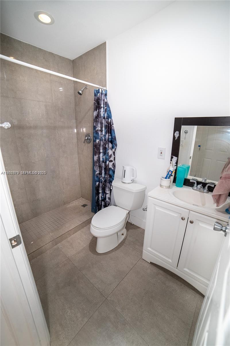 2501 Northwest 22nd Avenue Miami, FL 33142 - Photo 20 of 43 a bathroom with a sink toilet and shower