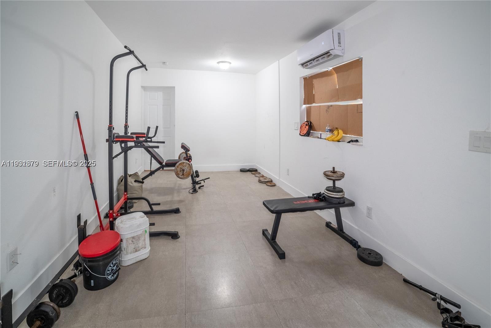 2501 Northwest 22nd Avenue Miami, FL 33142 - Photo 21 of 43 a view of a room with gym equipment