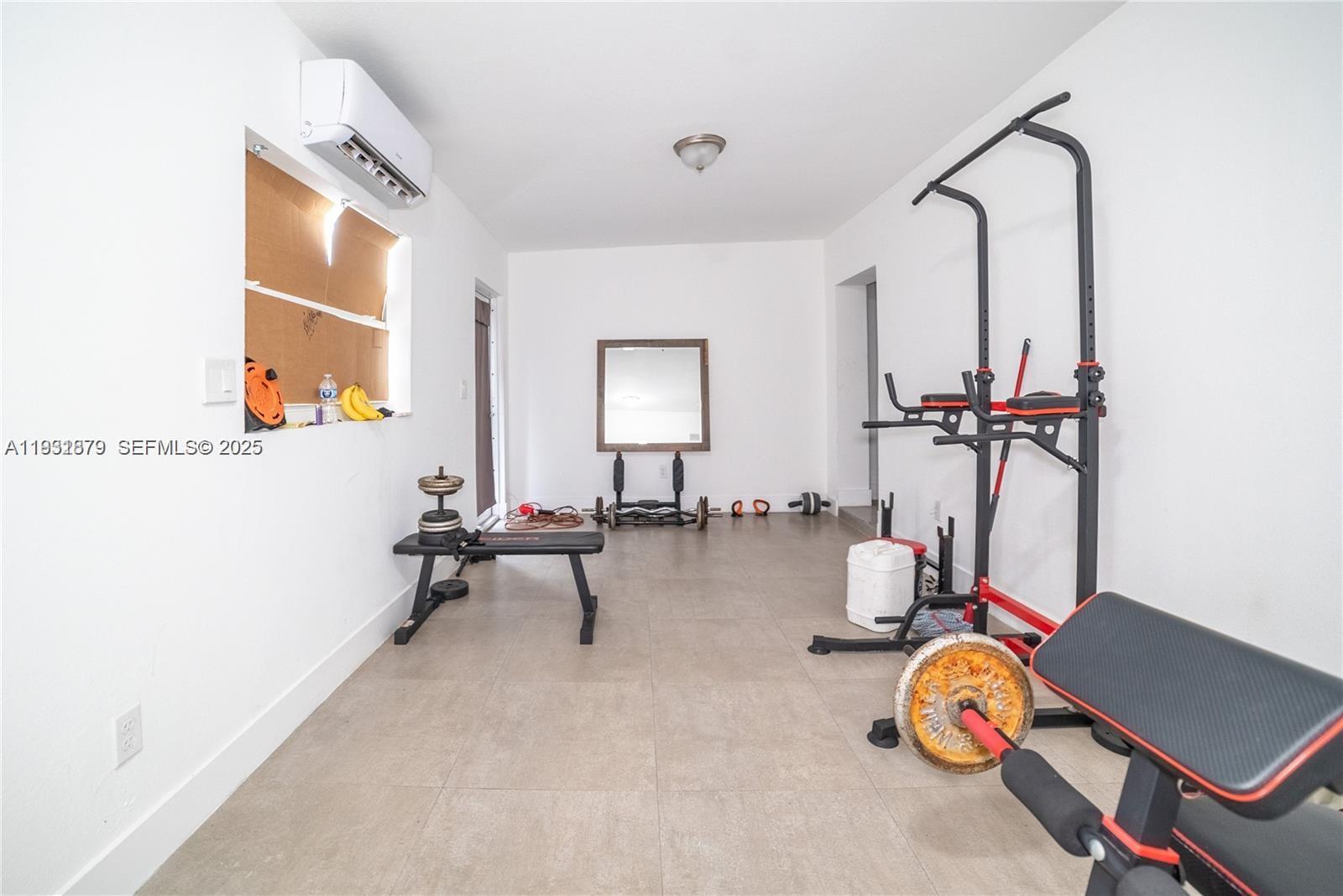 2501 Northwest 22nd Avenue Miami, FL 33142 - Photo 22 of 43 a view of a room with gym equipment