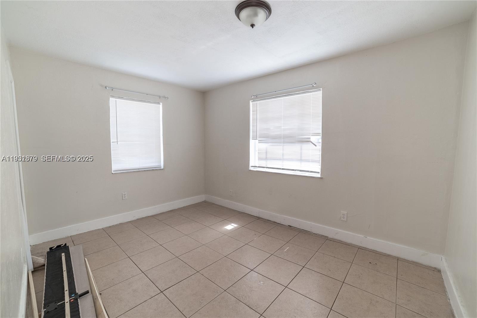 2501 Northwest 22nd Avenue Miami, FL 33142 - Photo 23 of 43 an empty room with windows